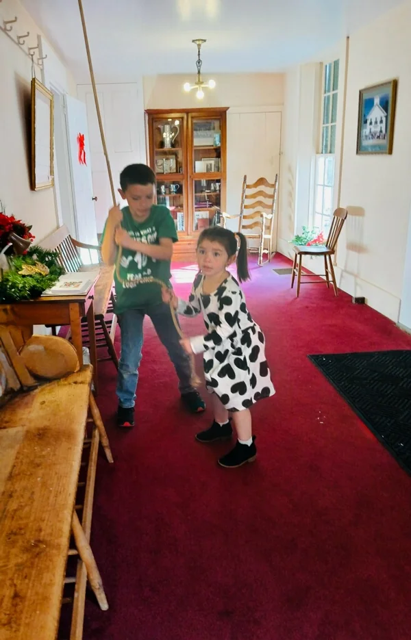 Kids ringing the bell at Congregational Church in Campton, NH